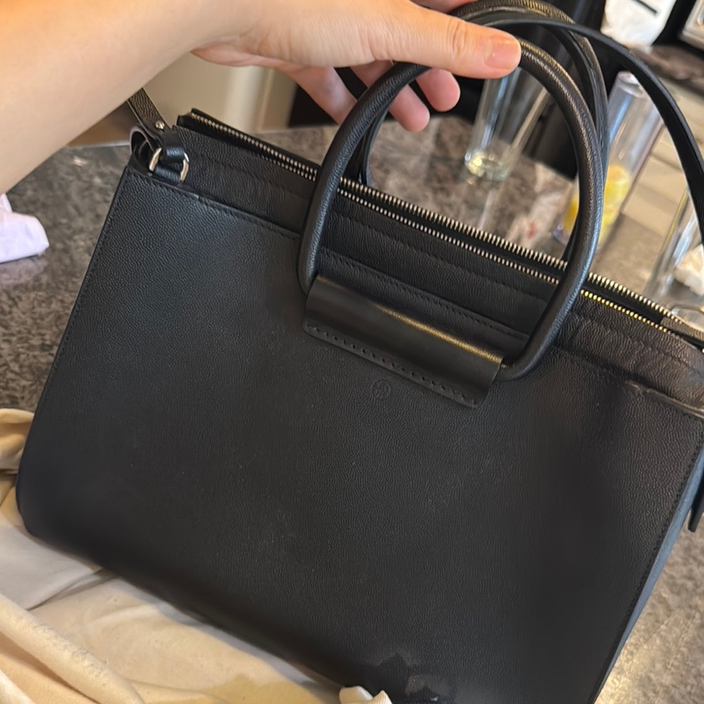 Black Satchel Bag with Structured Design and Zipper Closure